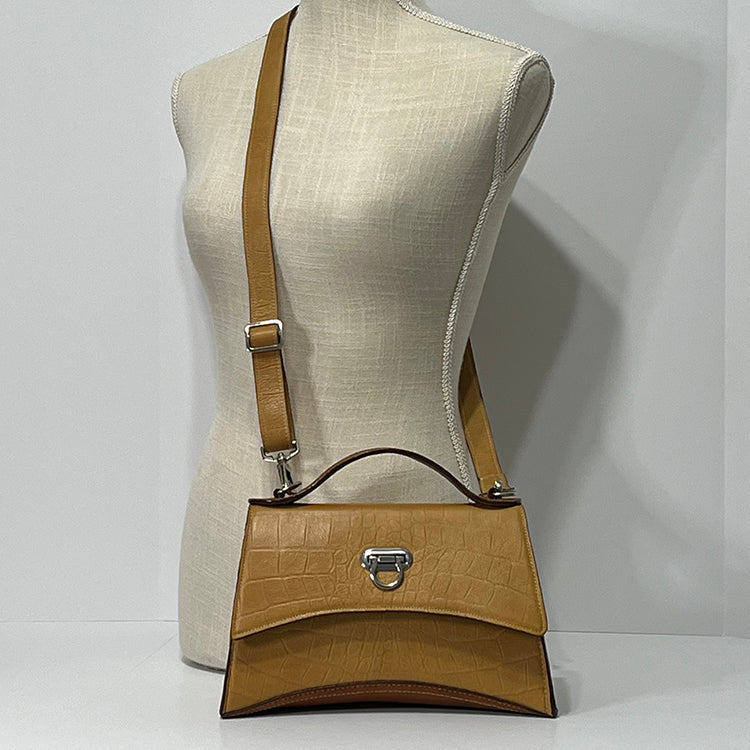 tan curve couture handbag