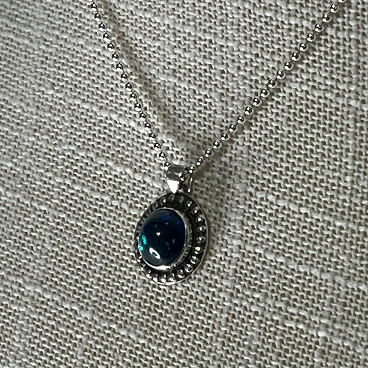 Ethiopian smoked fire opal 1.3ct round pendant