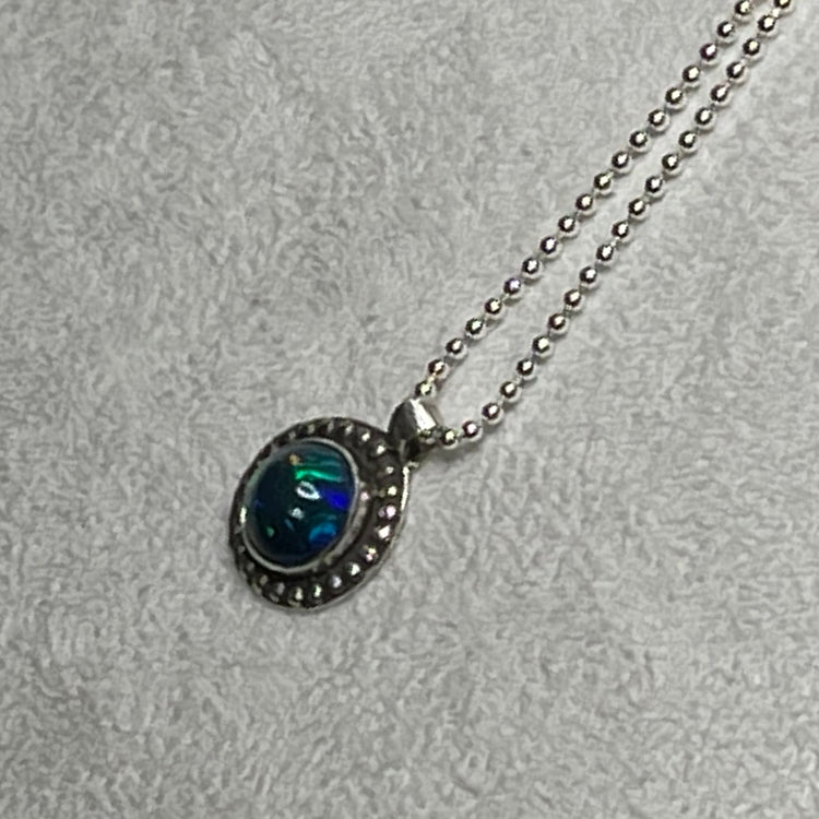 Ethiopian smoked fire opal 1.3ct round pendant