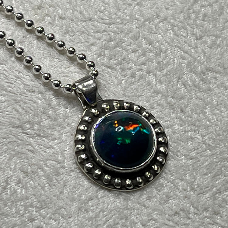 Ethiopian smoked fire opal 1.3ct round pendant