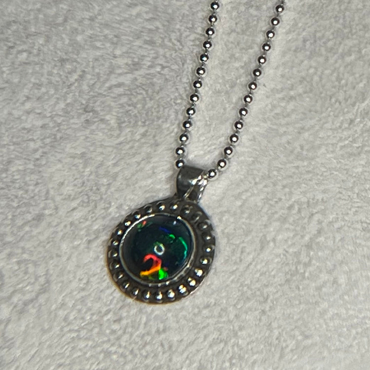 Ethiopian smoked fire opal 1.3ct round pendant