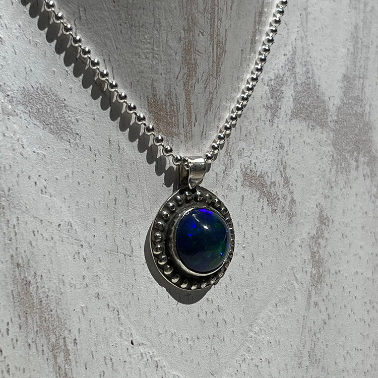 Ethiopian smoked fire opal 1.3ct round pendant