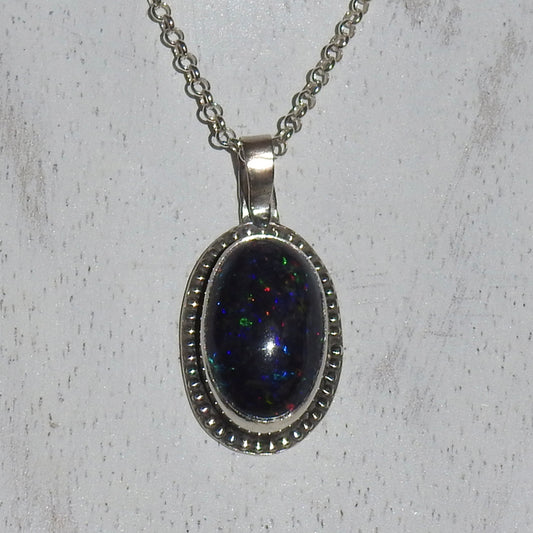 Ethiopian smoked fire opal 5.3ct oval pendant