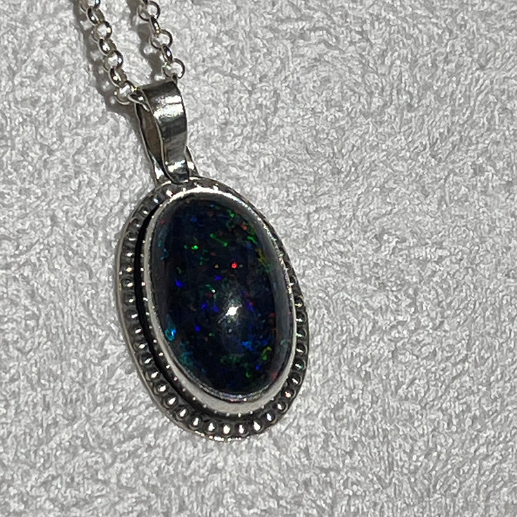 Ethiopian smoked fire opal 5.3ct oval pendant