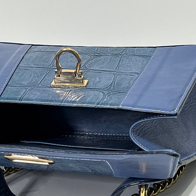 periwinkle curve couture handbag