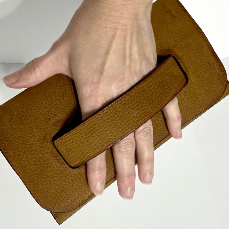 tan leather clutch