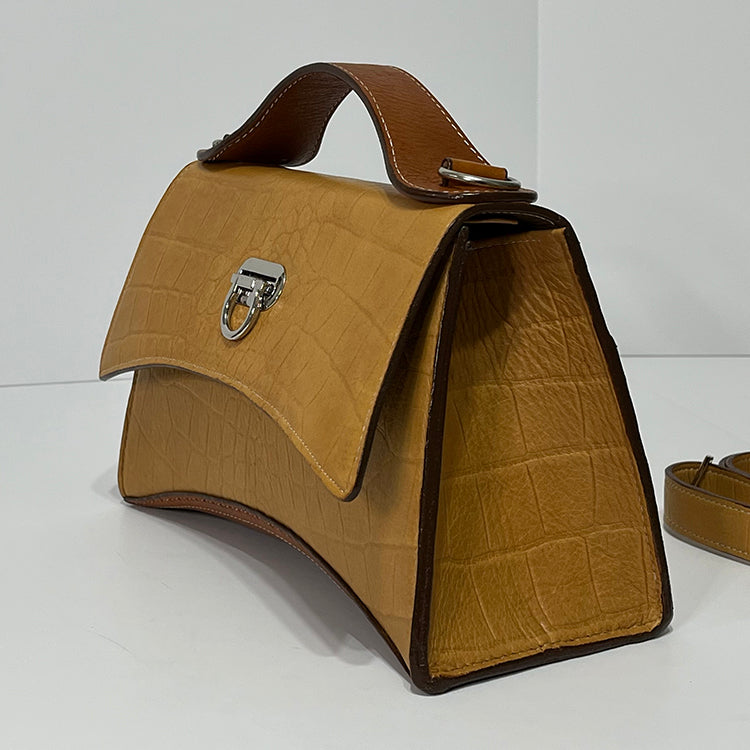 tan curve couture handbag