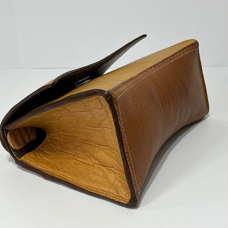 tan curve couture handbag
