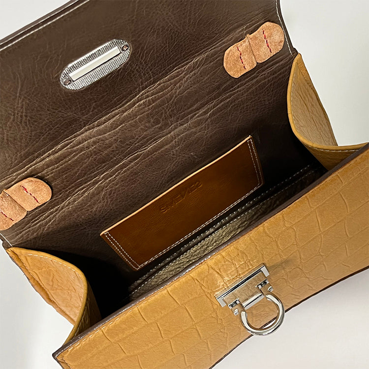 tan curve couture handbag