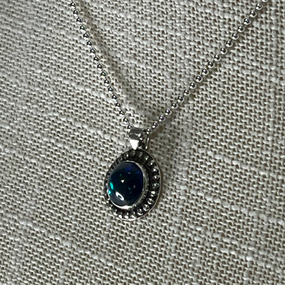 Ethiopian smoked fire opal 1.3ct round pendant