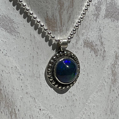 Ethiopian smoked fire opal 1.3ct round pendant