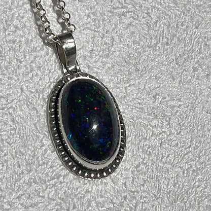 Ethiopian smoked fire opal 5.3ct oval pendant