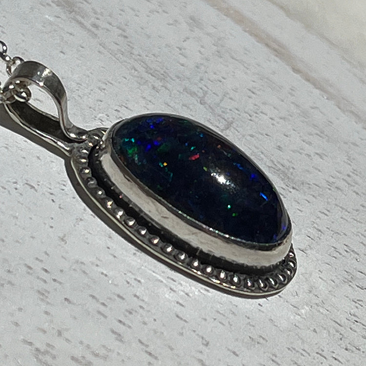 Ethiopian smoked fire opal 5.3ct oval pendant