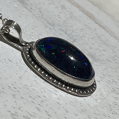 Ethiopian smoked fire opal 5.3ct oval pendant