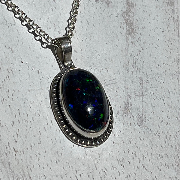 Ethiopian smoked fire opal 5.3ct oval pendant