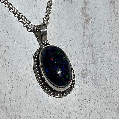 Ethiopian smoked fire opal 5.3ct oval pendant