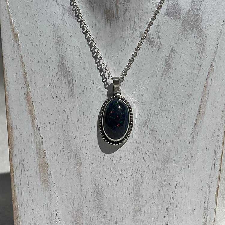 Ethiopian smoked fire opal 5.3ct oval pendant