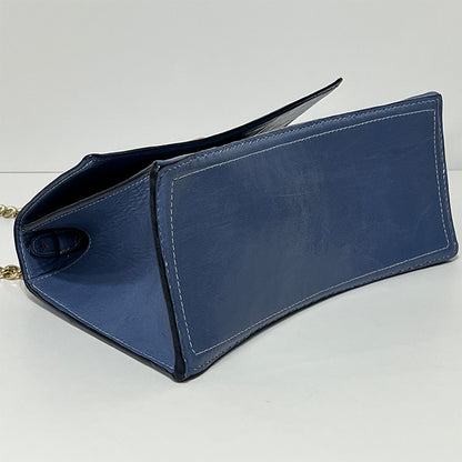 periwinkle curve couture handbag